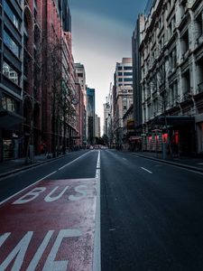 Preview wallpaper road, street, asphalt, buildings, city