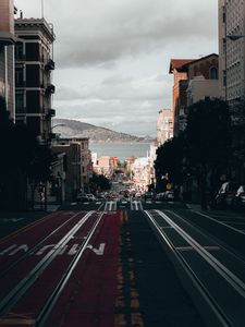 Preview wallpaper road, street, buildings, city, coast