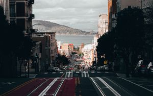 Preview wallpaper road, street, buildings, city, coast