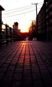 Preview wallpaper road, street, sunset, buildings