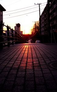 Preview wallpaper road, street, sunset, buildings