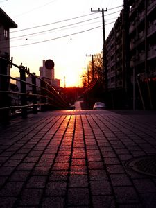 Preview wallpaper road, street, sunset, buildings