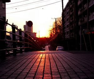 Preview wallpaper road, street, sunset, buildings