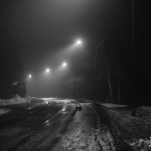 Preview wallpaper road, streetlights, night, snow, bw, dark