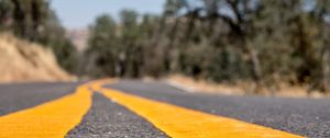 Preview wallpaper road, stripes, asphalt, yellow, blur