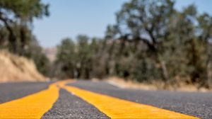 Preview wallpaper road, stripes, asphalt, yellow, blur