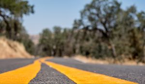 Preview wallpaper road, stripes, asphalt, yellow, blur