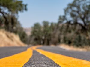 Preview wallpaper road, stripes, asphalt, yellow, blur