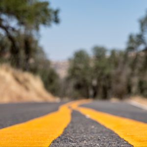 Preview wallpaper road, stripes, asphalt, yellow, blur