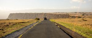 Preview wallpaper road, suv, field, hill