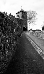 Preview wallpaper road, tower, wall, black and white