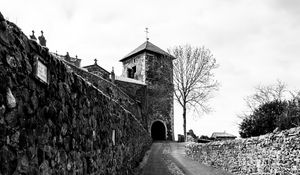 Preview wallpaper road, tower, wall, black and white