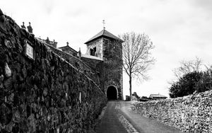 Preview wallpaper road, tower, wall, black and white