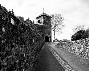 Preview wallpaper road, tower, wall, black and white