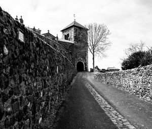 Preview wallpaper road, tower, wall, black and white