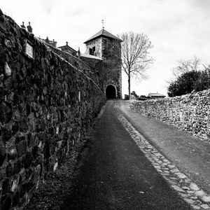 Preview wallpaper road, tower, wall, black and white