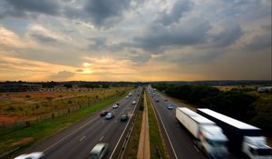 Preview wallpaper road, traffic, cars, sky, sunset