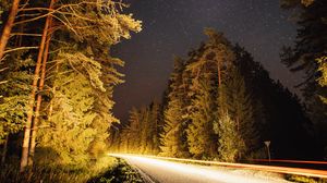 Preview wallpaper road, trees, forest, stars, night