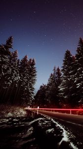 Preview wallpaper road, trees, night, snow, long exposure