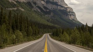 Preview wallpaper road, trees, rock, slope