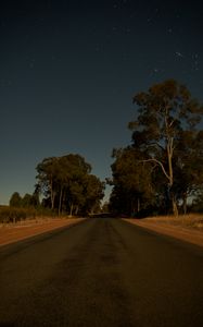 Preview wallpaper road, trees, stars, evening