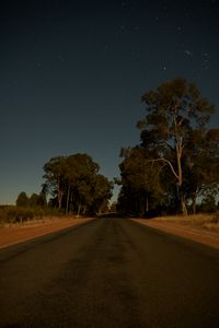 Preview wallpaper road, trees, stars, evening