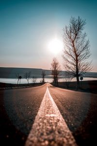 Preview wallpaper road, trees, sunset, sky, direction