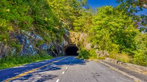 Preview wallpaper road, tunnel, darkness, trees, shadows