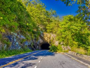 Preview wallpaper road, tunnel, darkness, trees, shadows