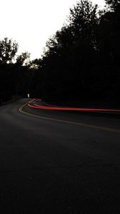 Preview wallpaper road, turn, dark, asphalt, trees