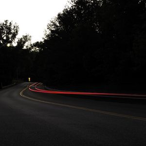 Preview wallpaper road, turn, dark, asphalt, trees