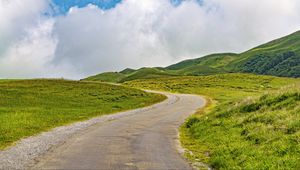 Preview wallpaper road, turn, field, grass, hills, nature