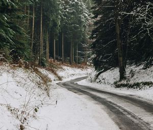 Preview wallpaper road, turn, forest, trees, snow, winter