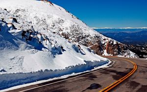 Preview wallpaper road, turn, lines, yellow, asphalt, mountains, snow