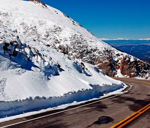 Preview wallpaper road, turn, lines, yellow, asphalt, mountains, snow