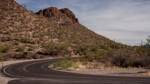 Preview wallpaper road, turn, mountain, slope, desert, landscape