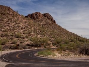 Preview wallpaper road, turn, mountain, slope, desert, landscape