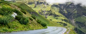 Preview wallpaper road, turn, mountains, relief, clouds, grass