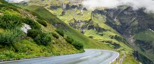 Preview wallpaper road, turn, mountains, relief, clouds, grass