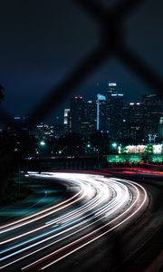 Preview wallpaper road, turn, night city, buildings, lights, long exposure