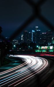 Preview wallpaper road, turn, night city, buildings, lights, long exposure