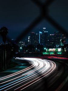 Preview wallpaper road, turn, night city, buildings, lights, long exposure