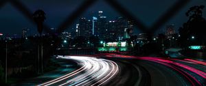 Preview wallpaper road, turn, night city, buildings, lights, long exposure