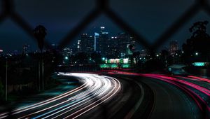 Preview wallpaper road, turn, night city, buildings, lights, long exposure