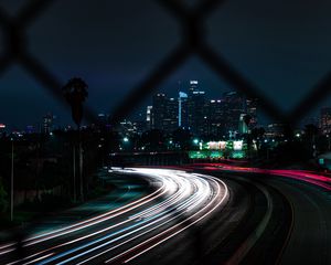 Preview wallpaper road, turn, night city, buildings, lights, long exposure