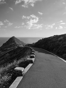 Preview wallpaper road, turn, rocks, mountains, black and white