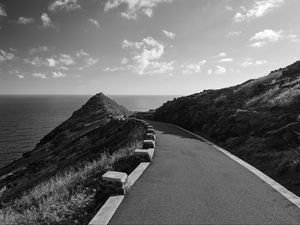 Preview wallpaper road, turn, rocks, mountains, black and white