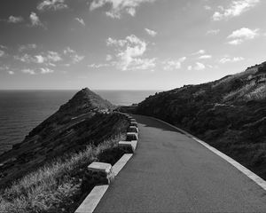 Preview wallpaper road, turn, rocks, mountains, black and white