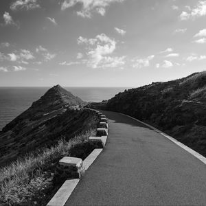 Preview wallpaper road, turn, rocks, mountains, black and white