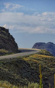 Preview wallpaper road, turn, rocks, hills